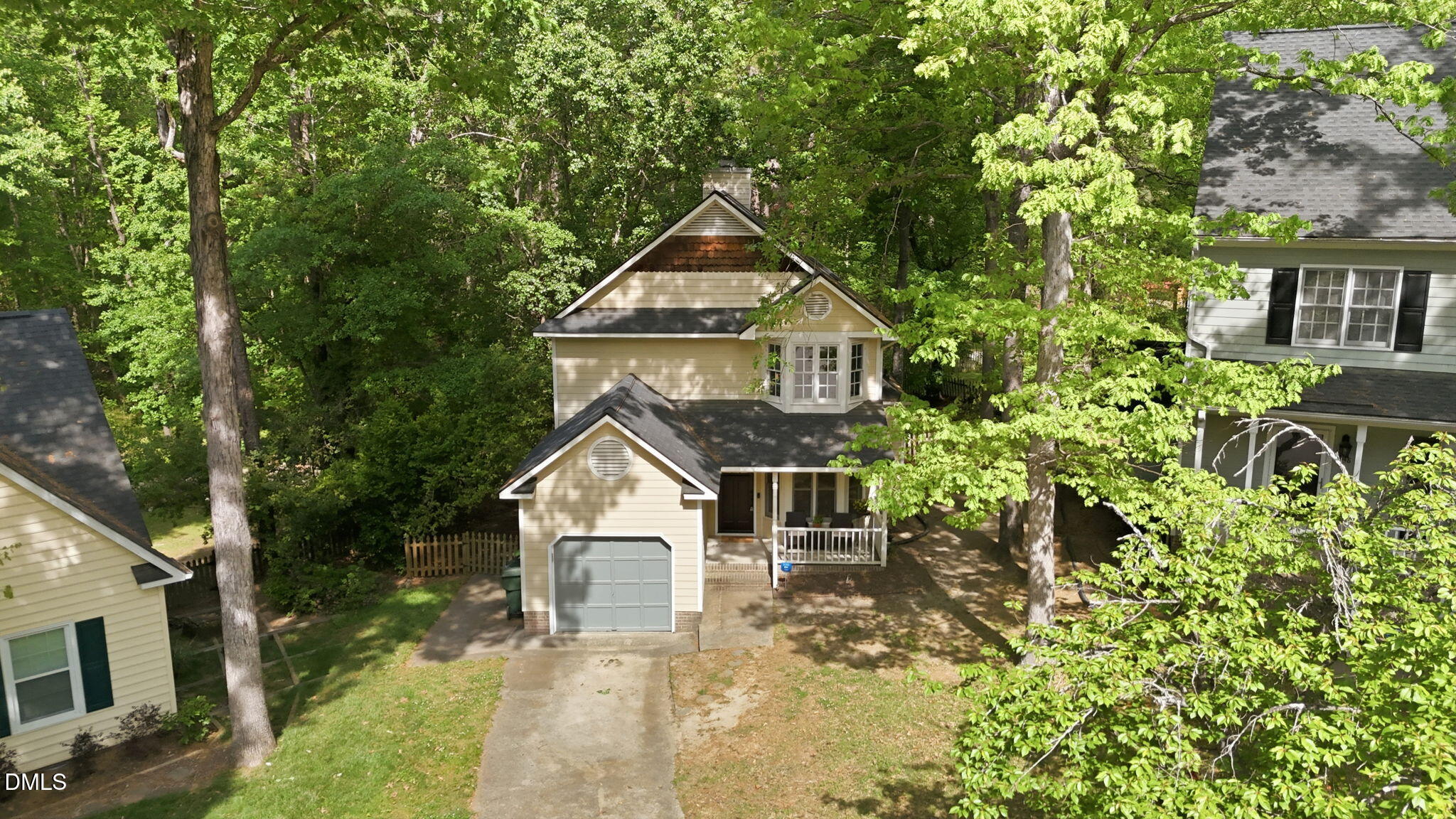 4952 Liverpool Lane Raleigh, NC 27604 - Photo 3 of 44 a front view of a house with a yard garage and outdoor seating