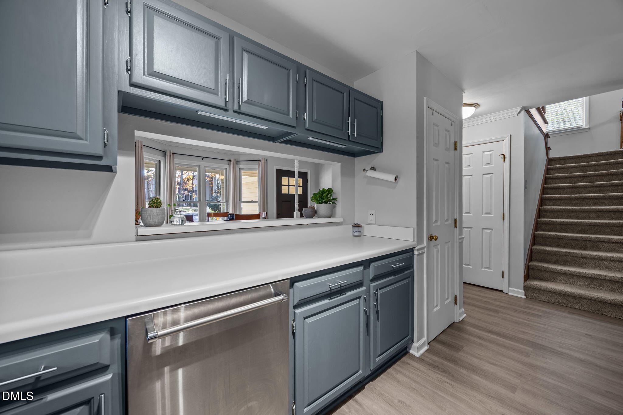 4952 Liverpool Lane Raleigh, NC 27604 - Photo 9 of 44 a kitchen with stainless steel appliances granite countertop a refrigerator and cabinets
