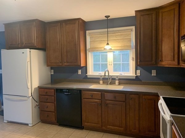 155 Barre Paxton Road Rutland, MA 01543 - Photo 15 of 42 a kitchen with stainless steel appliances granite countertop a refrigerator and a sink