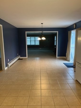 155 Barre Paxton Road Rutland, MA 01543 - Photo 16 of 42 a view of an empty room with a fireplace
