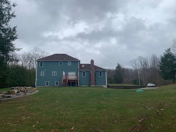 155 Barre Paxton Road Rutland, MA 01543 - Photo 4 of 42 a view of a big house with a big yard and large trees
