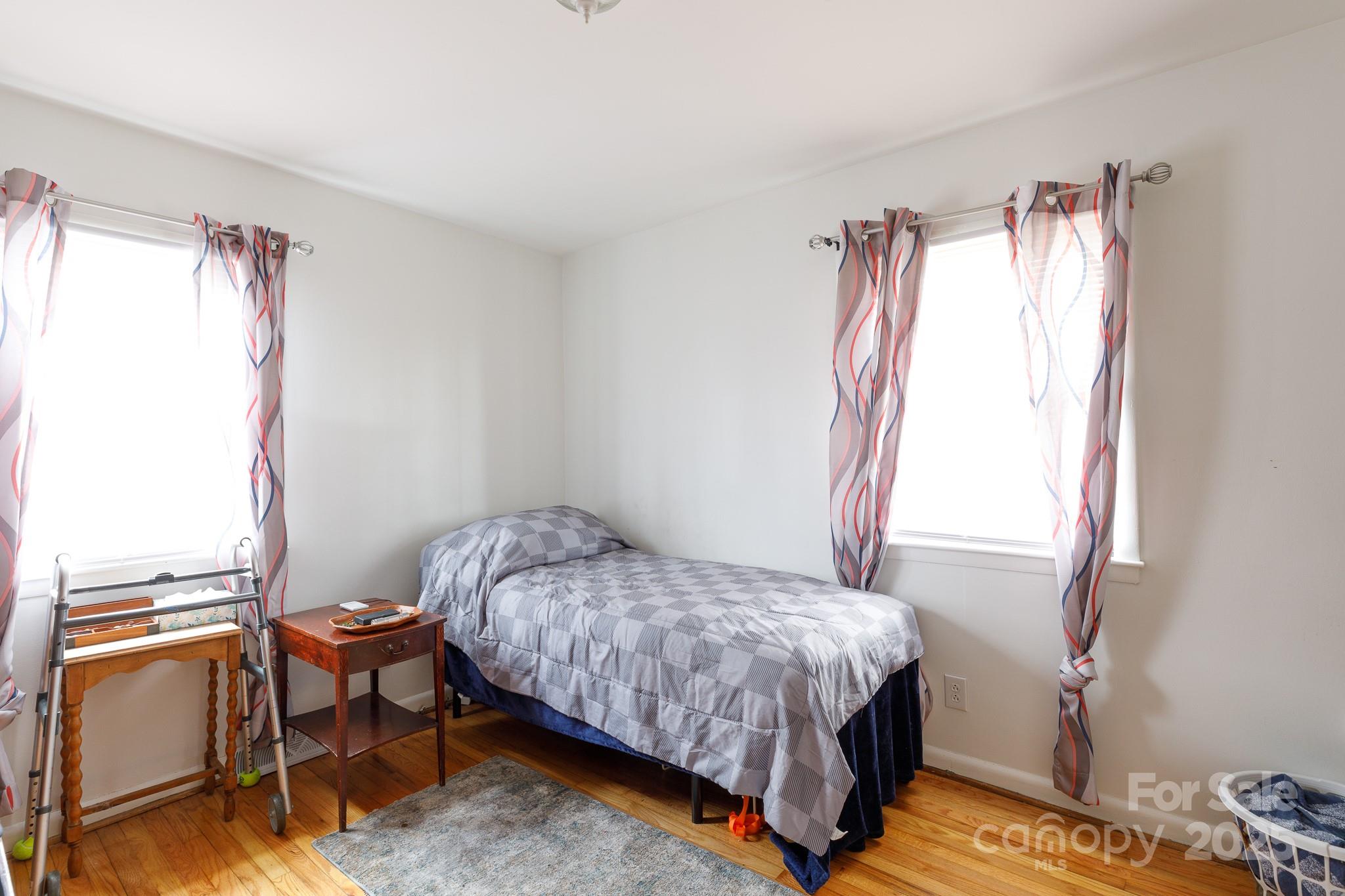 103 Perry Street Shelby, NC 28150 - Photo 13 of 22 a bedroom with a bed and a window