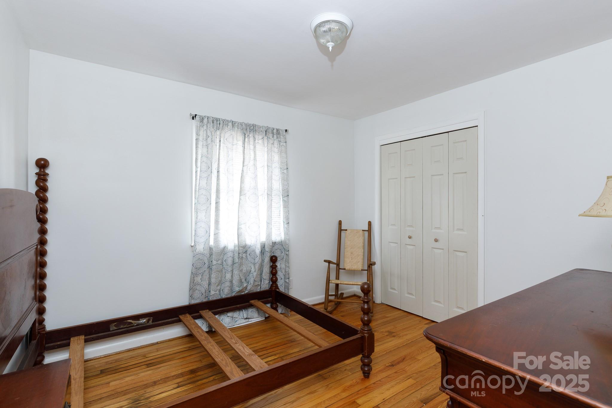 103 Perry Street Shelby, NC 28150 - Photo 15 of 22 a view of a room with window and hardwood floor