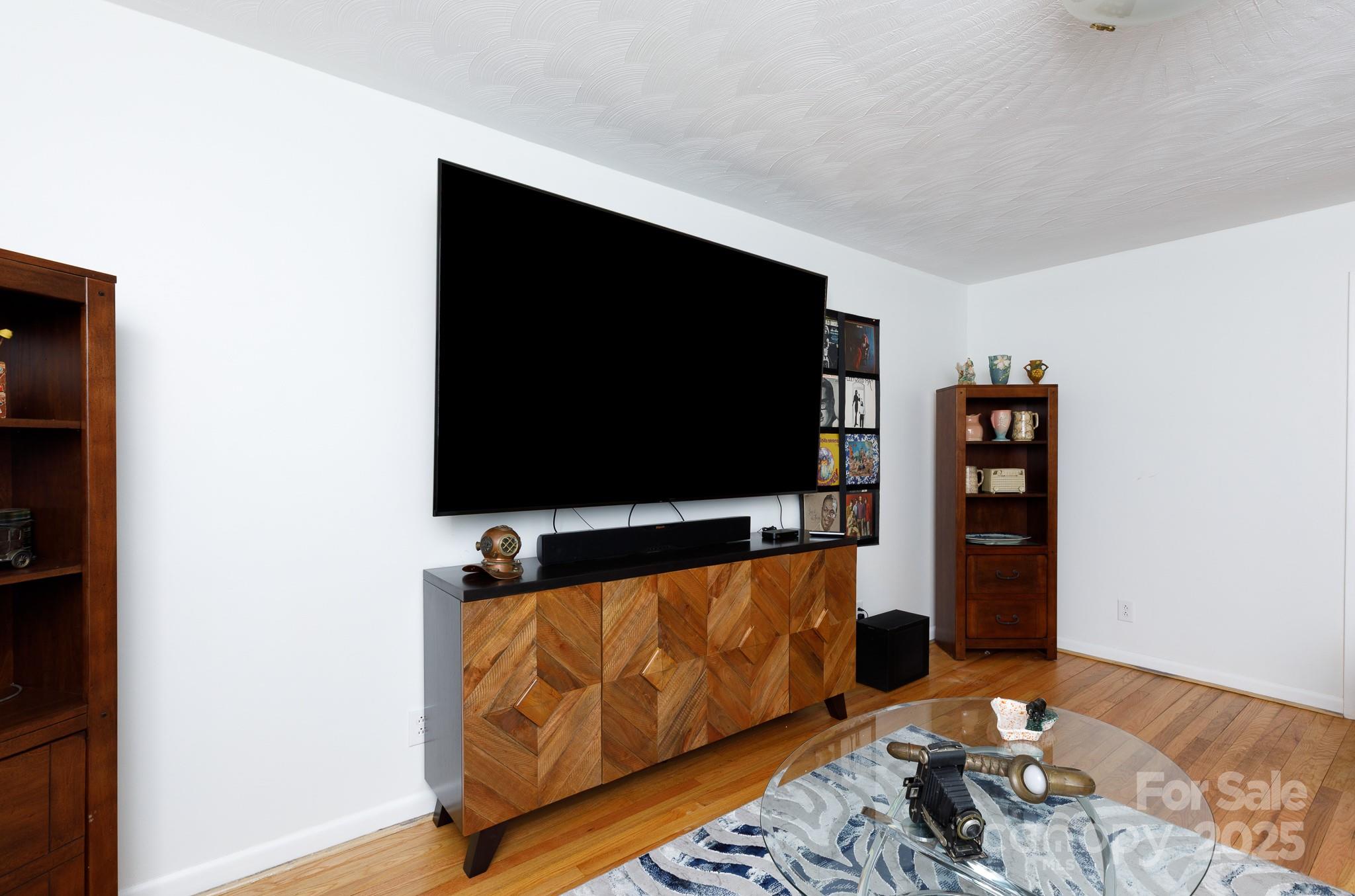 103 Perry Street Shelby, NC 28150 - Photo 17 of 22 a living room with furniture and a flat screen tv