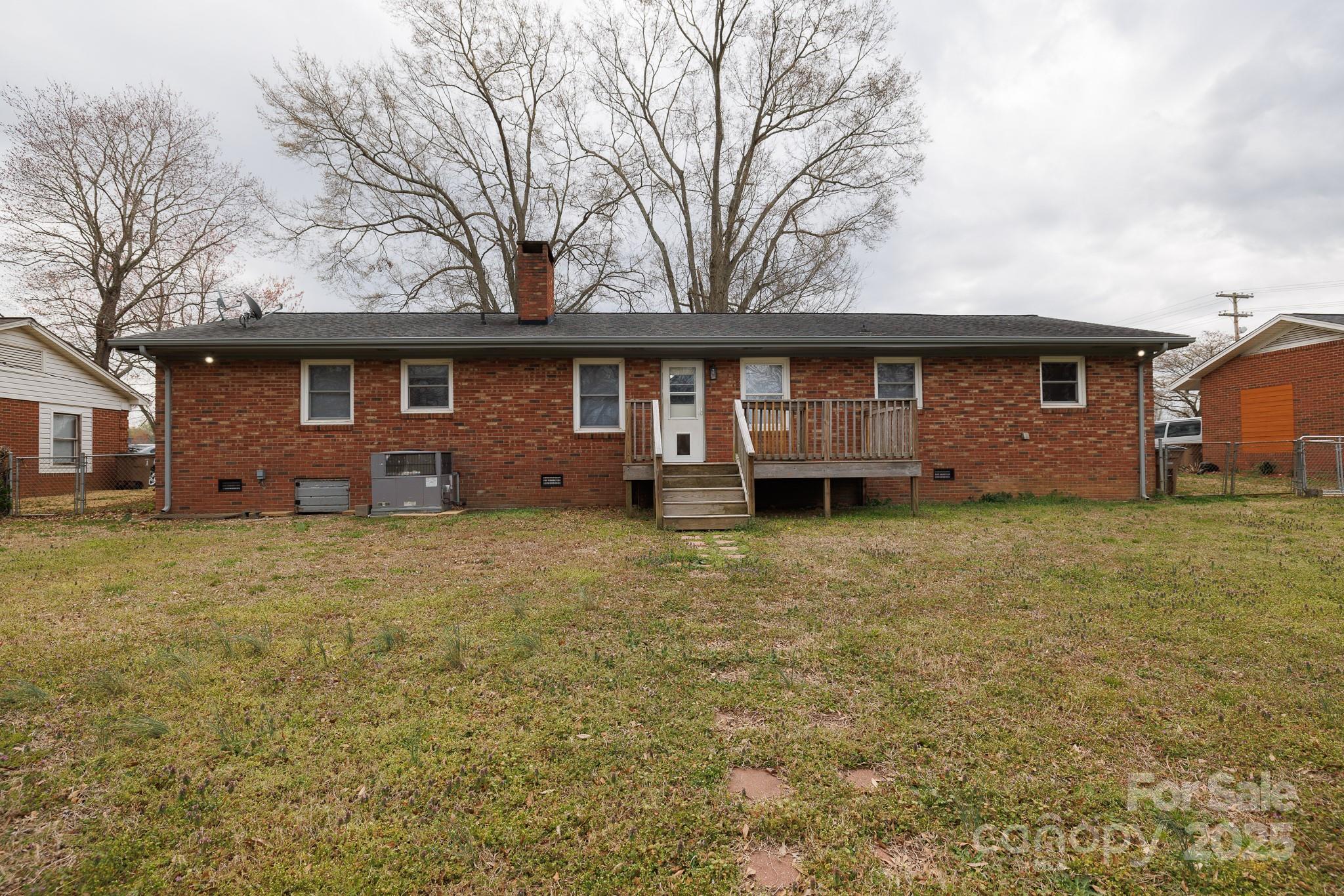 103 Perry Street Shelby, NC 28150 - Photo 20 of 22 a view of a house with backyard and garden