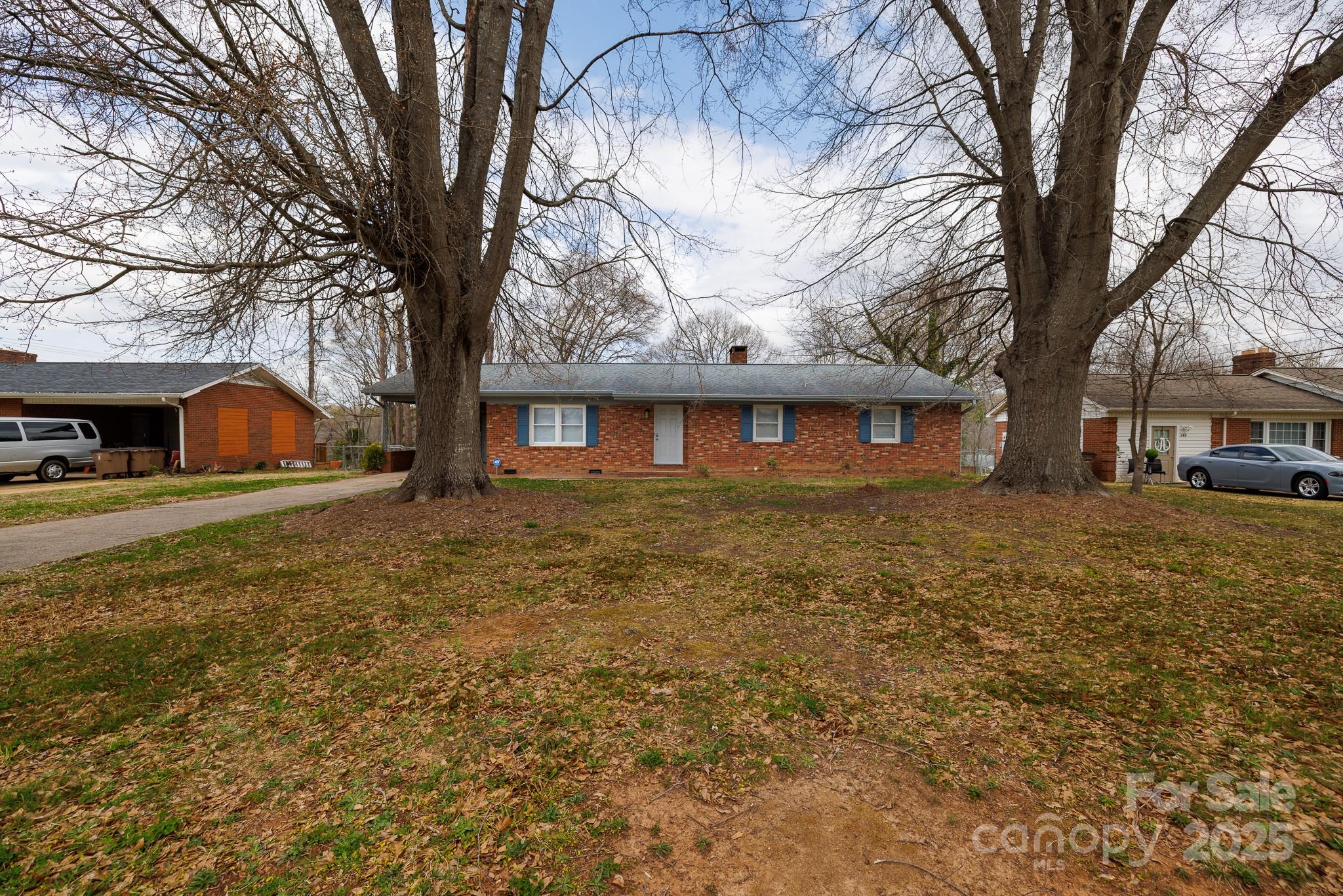 103 Perry Street Shelby, NC 28150 - Photo 21 of 22 a front view of house with yard and trees around