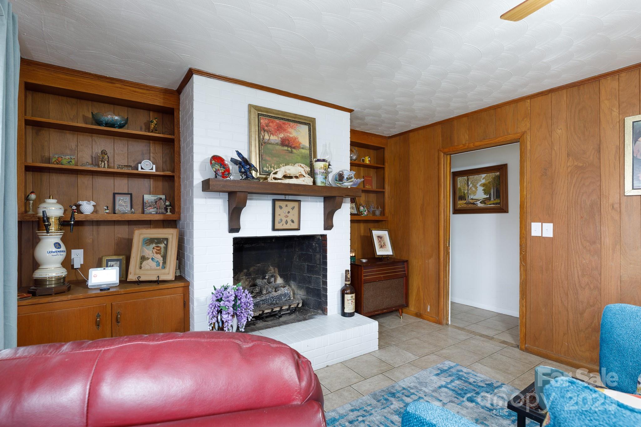 103 Perry Street Shelby, NC 28150 - Photo 7 of 22 a bedroom with furniture and a fireplace