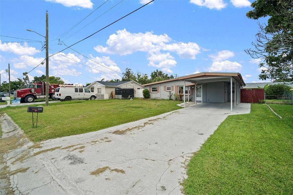 4712 Bessie Road Tampa, FL 33615 - Photo 28 of 28 a view of house with a yard