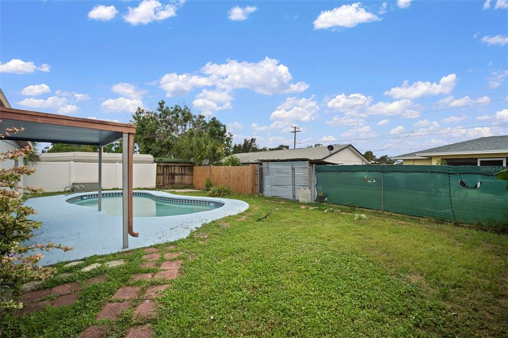 4712 Bessie Road Tampa, FL 33615 - Photo 3 of 28 a view of a backyard