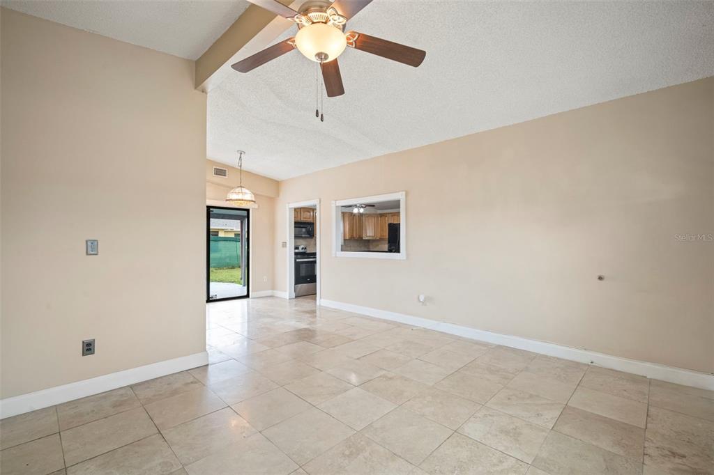 4712 Bessie Road Tampa, FL 33615 - Photo 10 of 28 an empty room with fan and windows