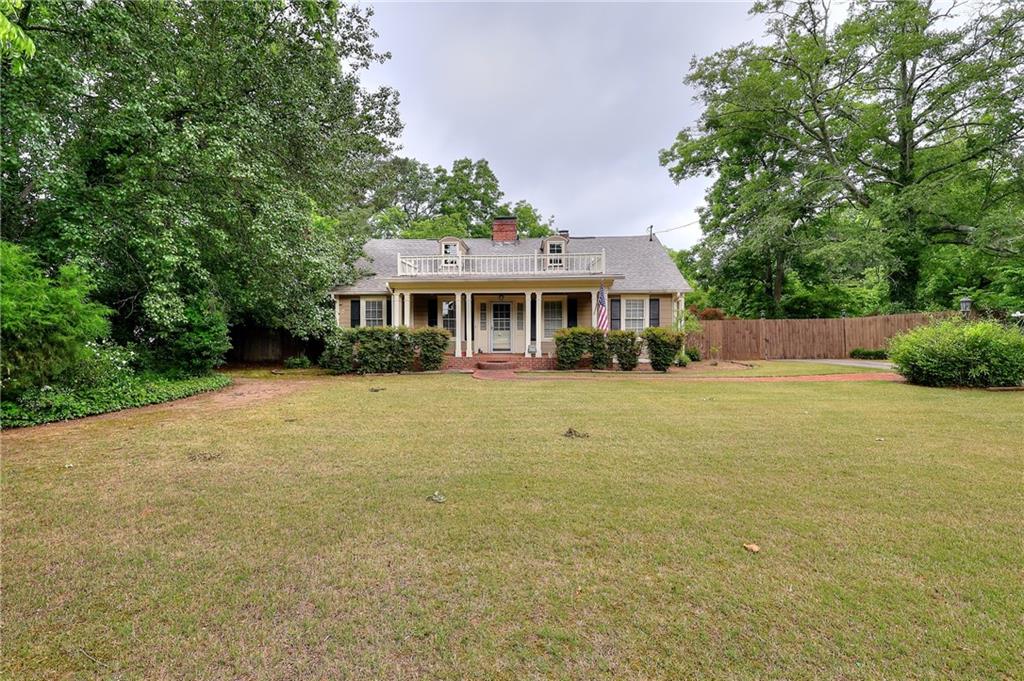 317 North Cherokee Road Social Circle, GA 30025 - Photo 3 of 32 a view of a house with a swimming pool