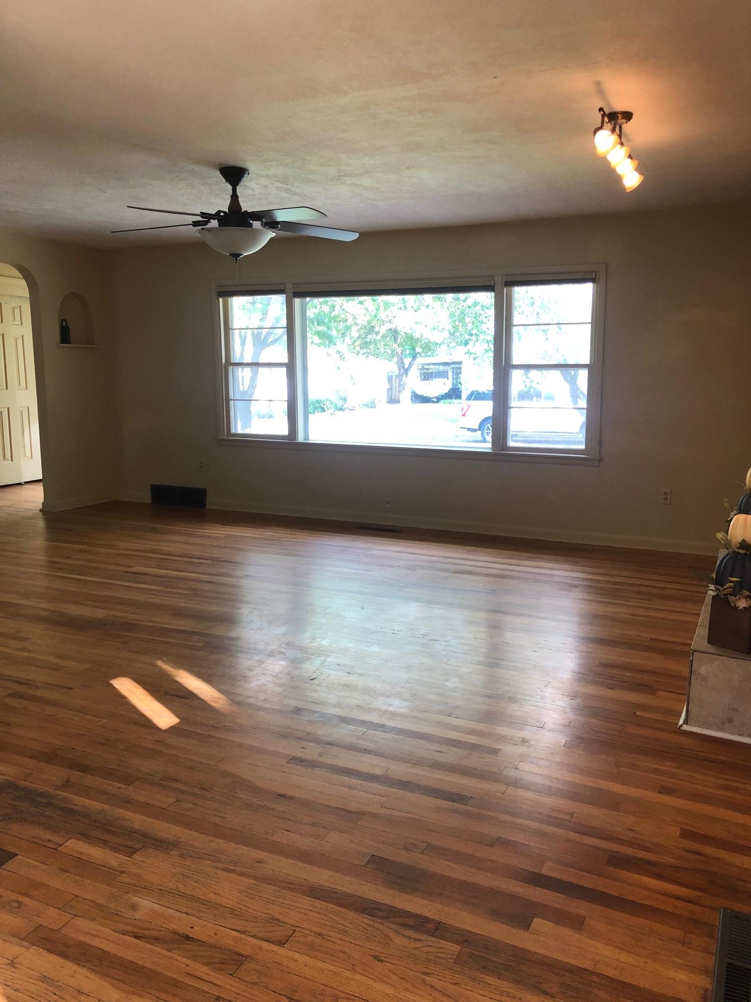 445 Hall Avenue Grand Junction, CO 81501 - Photo 11 of 23 a view of empty room with wooden floor and fan