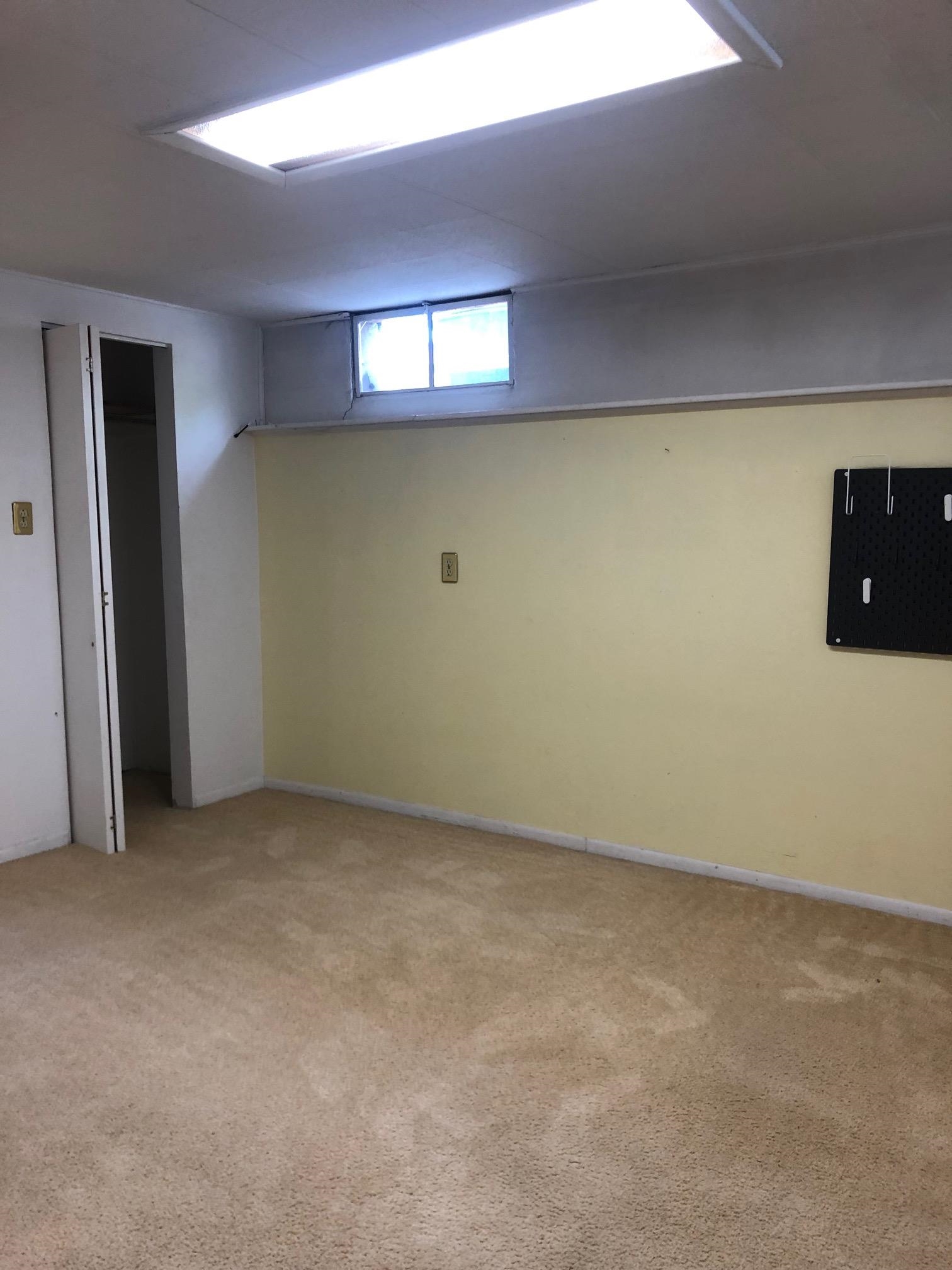 445 Hall Avenue Grand Junction, CO 81501 - Photo 23 of 23 a view of an empty room with a fireplace