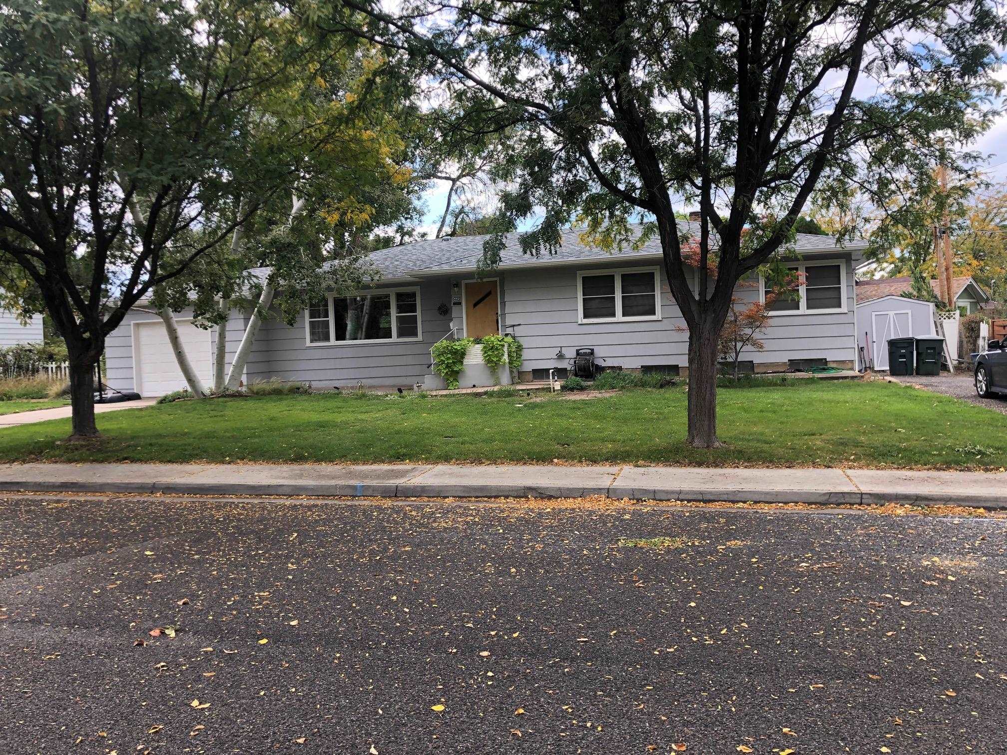 445 Hall Avenue Grand Junction, CO 81501 - Photo 3 of 23 a front view of a house with a yard and trees