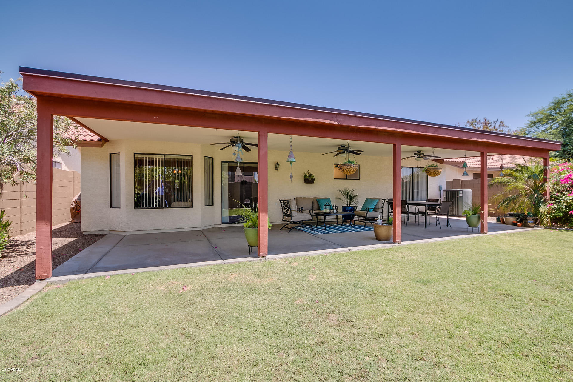 3623 East Agave Road Phoenix, AZ 85044 - Photo 33 of 41 a view of a house with backyard porch and sitting area