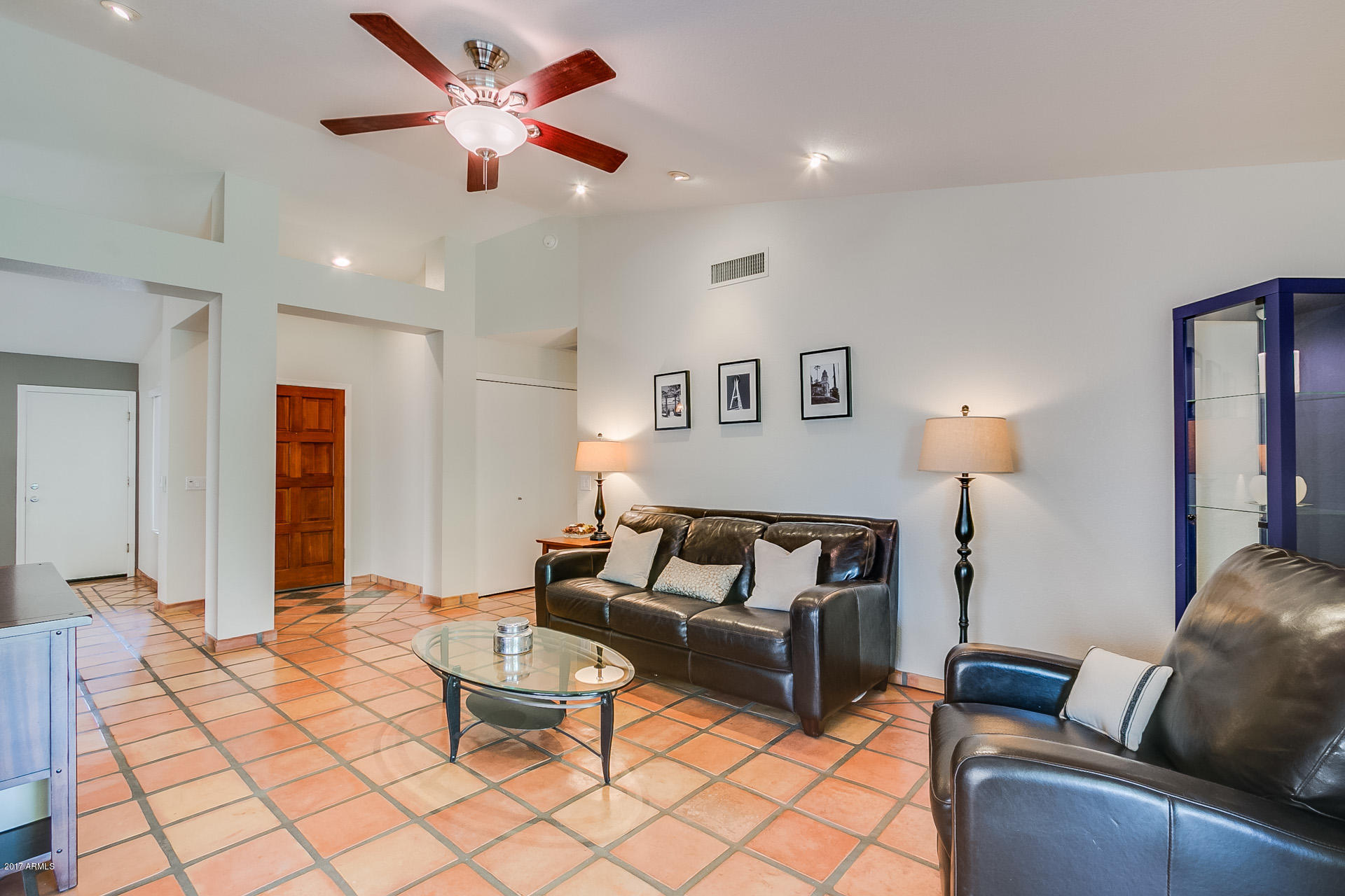 3623 East Agave Road Phoenix, AZ 85044 - Photo 4 of 41 a living room with furniture and a chandelier