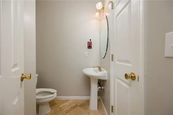 a bathroom with a sink and toilet
