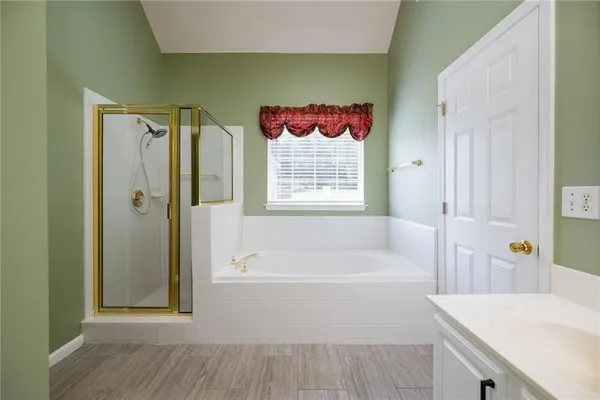 a bathroom with a bathtub and a sink