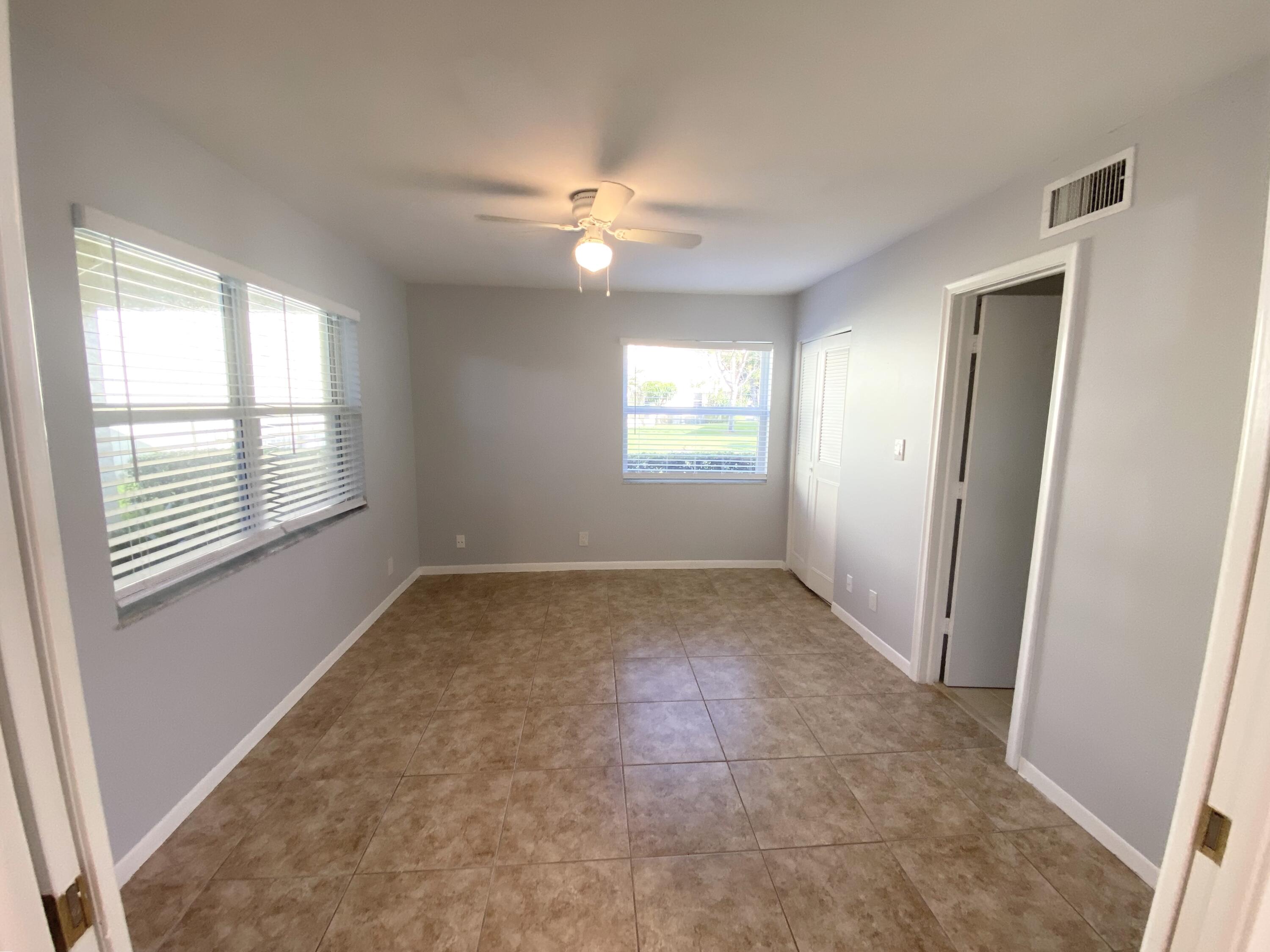 1100 Boxwood Drive, Unit 101 Delray Beach, FL 33445 - Photo 14 of 33 a view of an empty room with a window