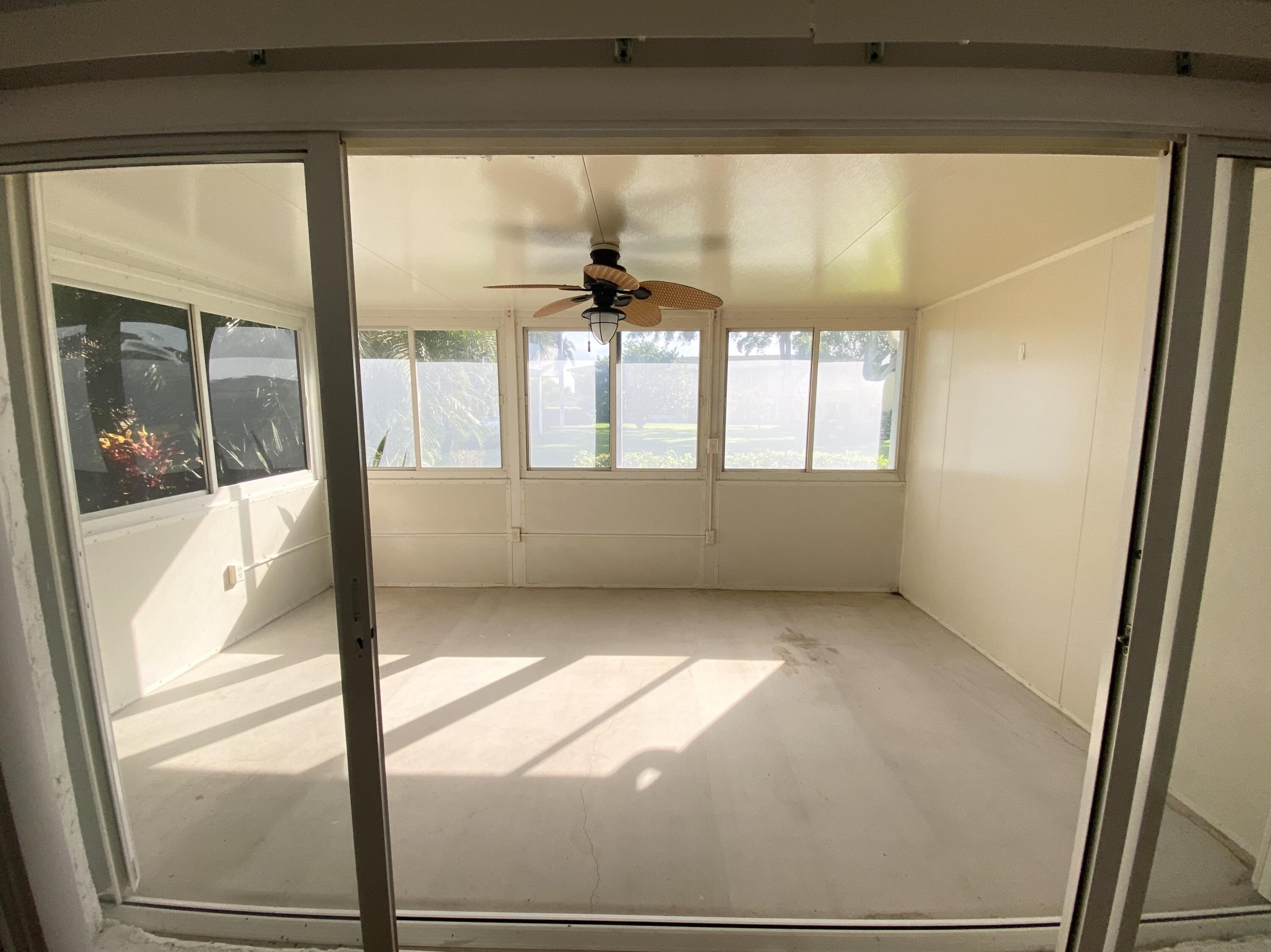 1100 Boxwood Drive, Unit 101 Delray Beach, FL 33445 - Photo 2 of 33 a view of an empty room and window