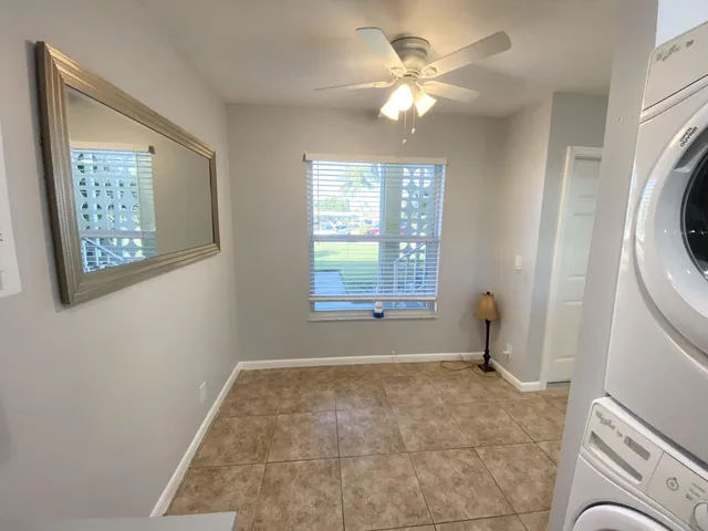 a view of livingroom with window and ceiling fan