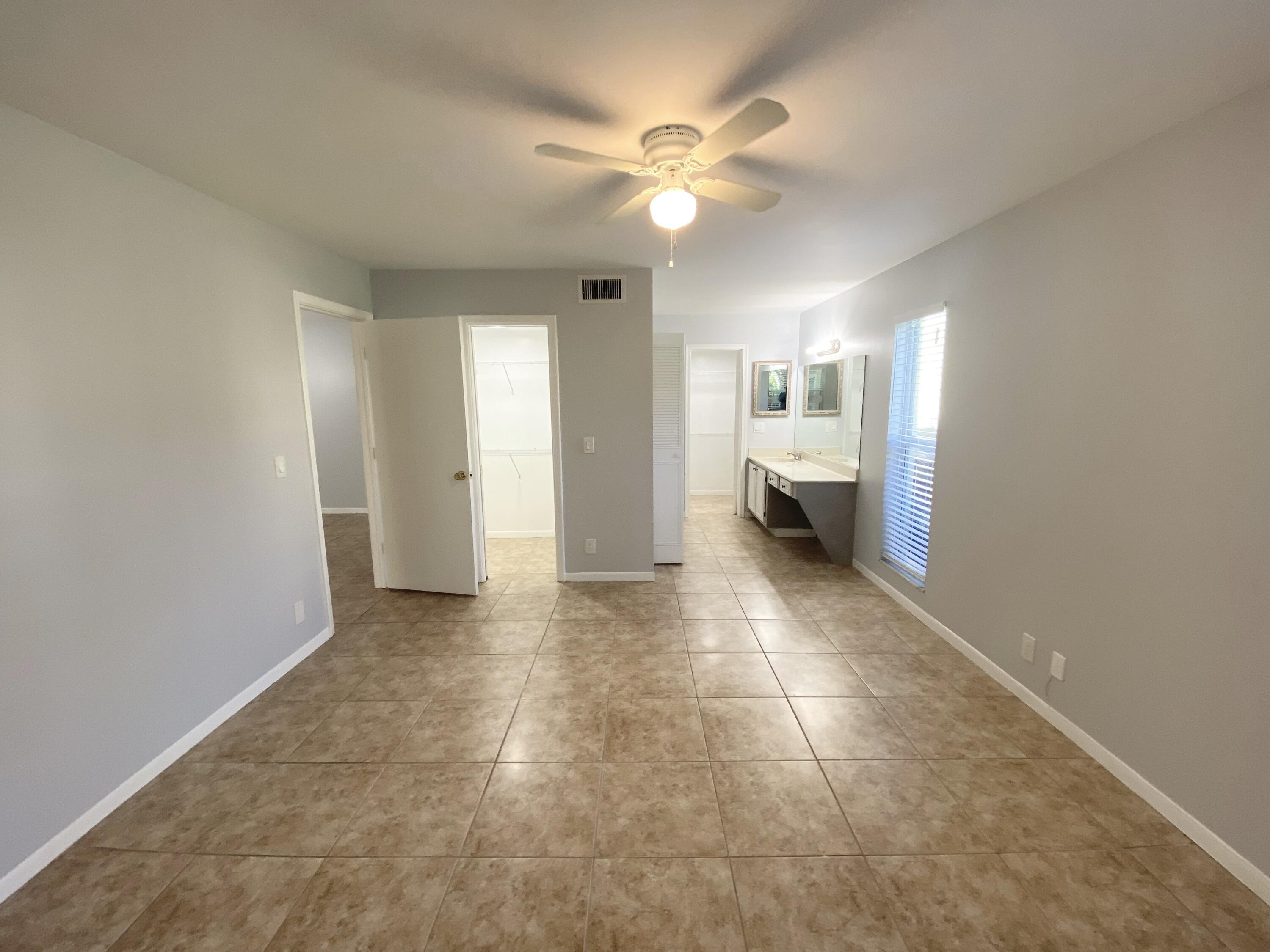 1100 Boxwood Drive, Unit 101 Delray Beach, FL 33445 - Photo 10 of 33 a view of an empty room and window
