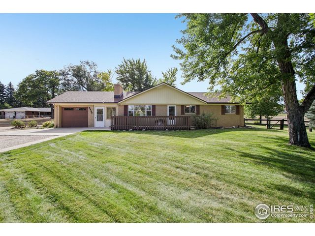 a living room with furniture and window