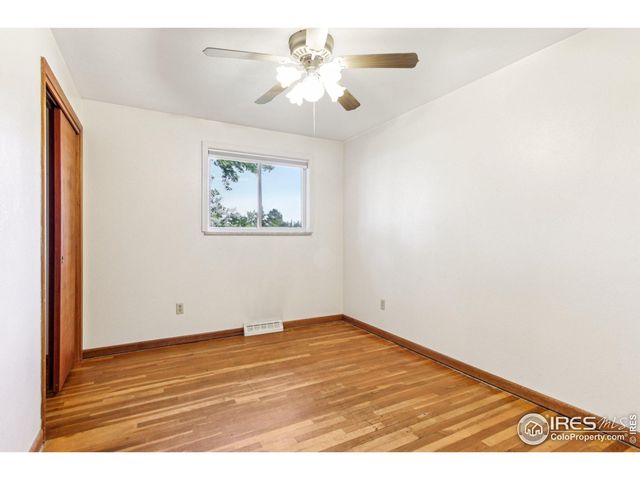a view of a livingroom with wooden furniture