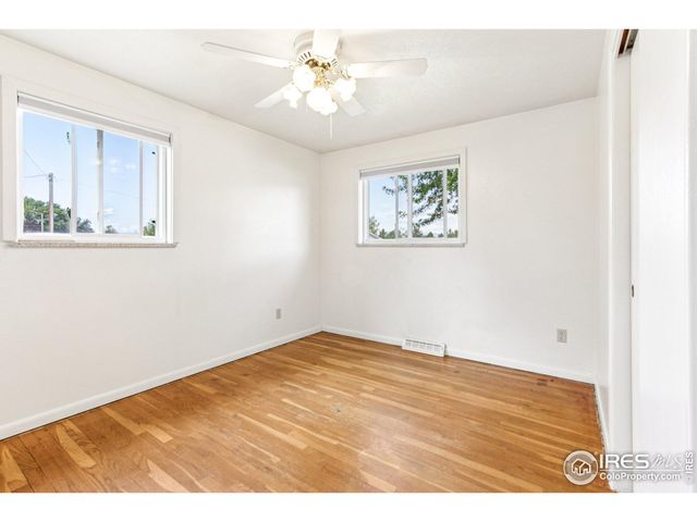 a view of a living room and a floor to ceiling window