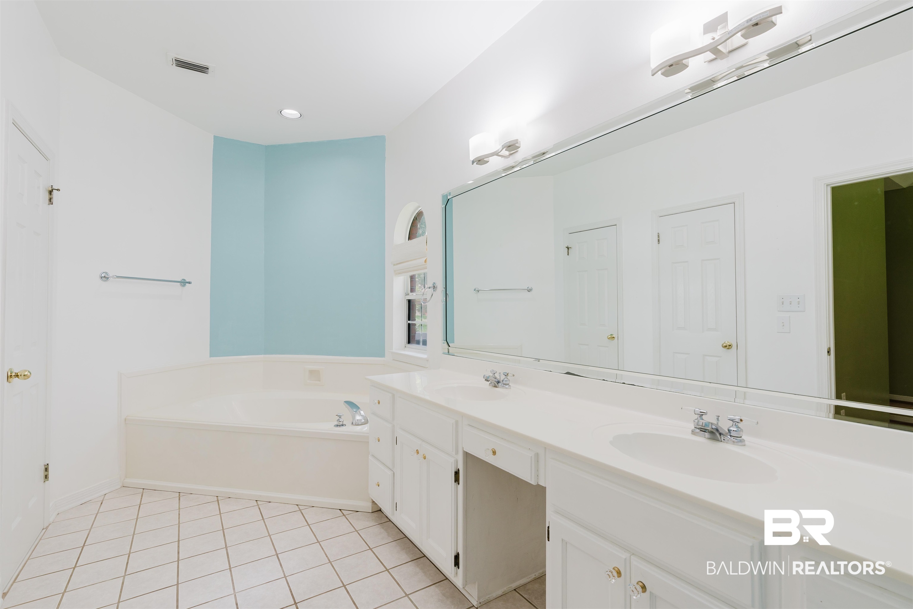19711 Hunters Loop Fairhope, AL 36532 - Photo 23 of 49 Full bath with double vanity, a garden tub, tile patterned floors, and baseboards