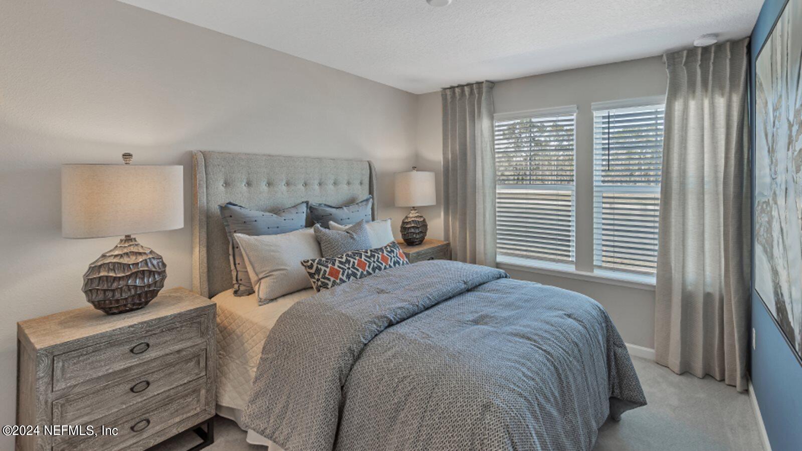 4338 Leeward Breeze Loop Middleburg, FL 32068 - Photo 8 of 13 a bedroom with a bed and a window