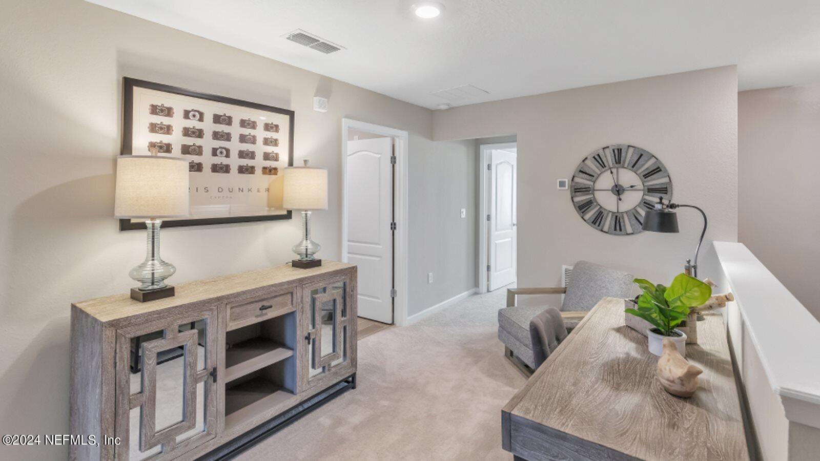 4338 Leeward Breeze Loop Middleburg, FL 32068 - Photo 10 of 13 a living room with stainless steel appliances furniture a stove and a window