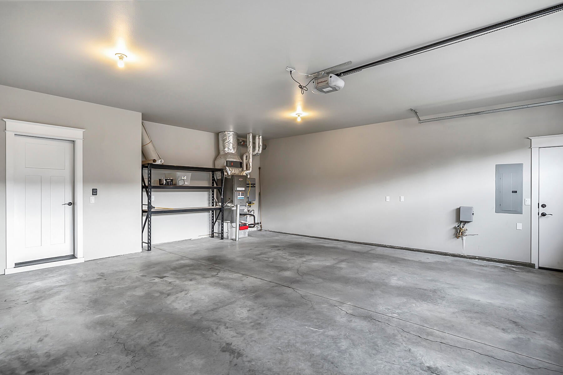 2612 Northwest Compass Corner Loop Bend, OR 97703 - Photo 42 of 44 Over-sized two car garage with gas furnace and tankless hot water heater