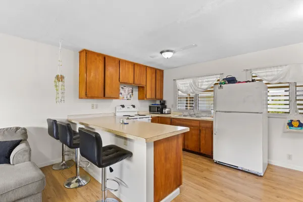 a kitchen that has a cabinets and a stove in it