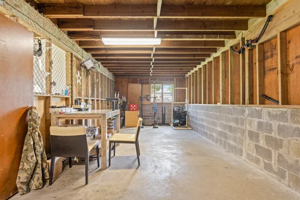 a dining room with furniture and a rug
