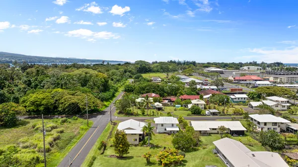 an aerial view of residential house with outdoor space and swimming pool