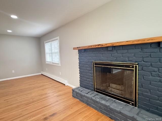 227 Whalesback Road Red Hook, NY 12571 - Photo 4 of 19 wood finished floors, recessed lighting, and a brick fireplace