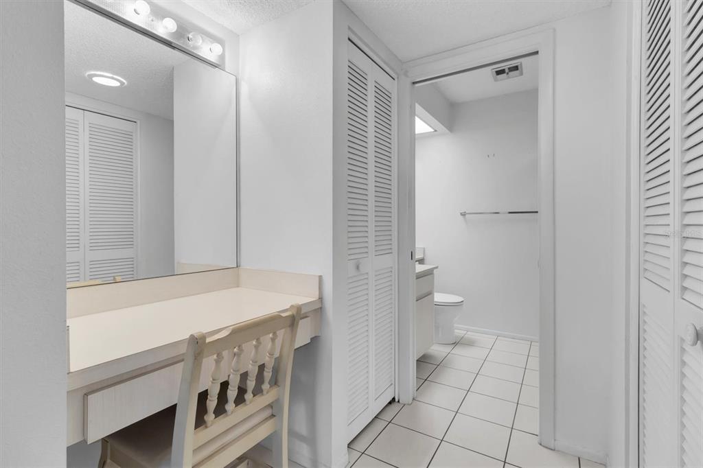 11410 Carriage Hill Drive, Unit 1 Port Richey, FL 34668 - Photo 15 of 63 a bathroom with a sink a toilet and shower