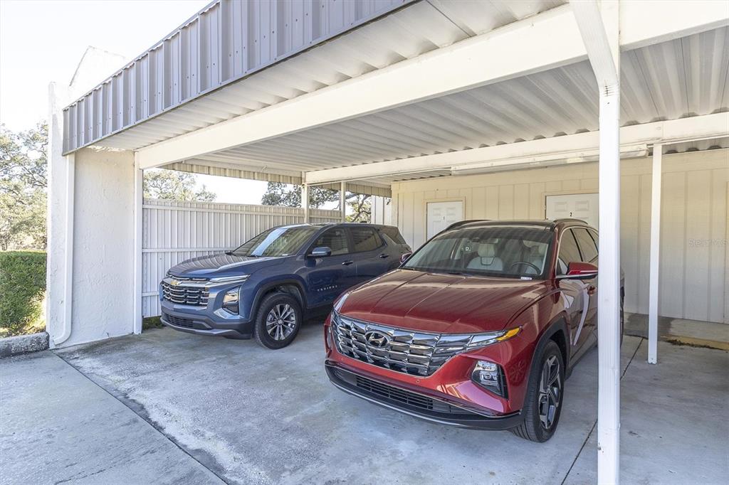 11410 Carriage Hill Drive, Unit 1 Port Richey, FL 34668 - Photo 29 of 63 a car parked in a garage