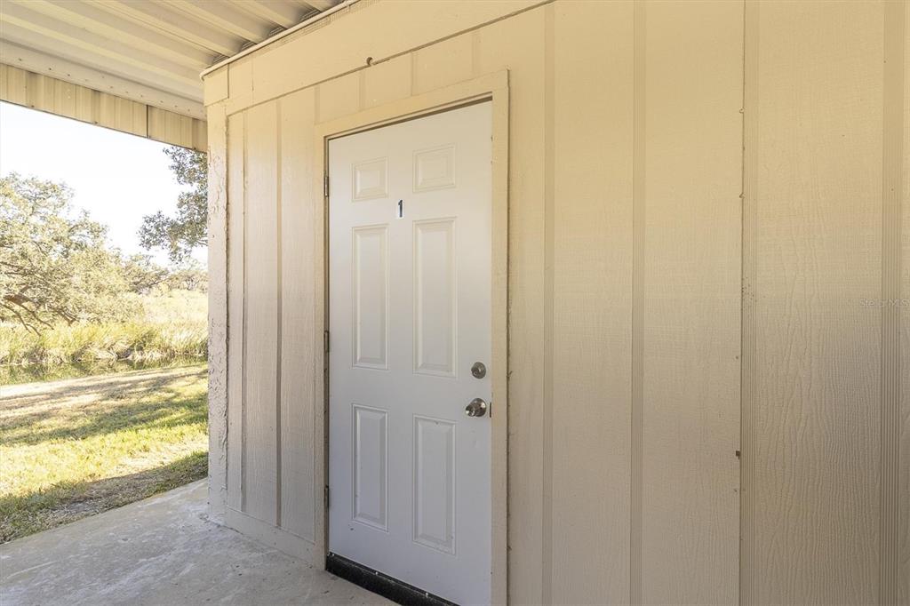 11410 Carriage Hill Drive, Unit 1 Port Richey, FL 34668 - Photo 30 of 63 a view of a bathroom from a window