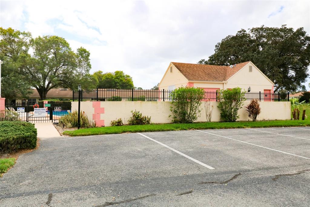 11410 Carriage Hill Drive, Unit 1 Port Richey, FL 34668 - Photo 38 of 63 a view of a house with a yard and a garden