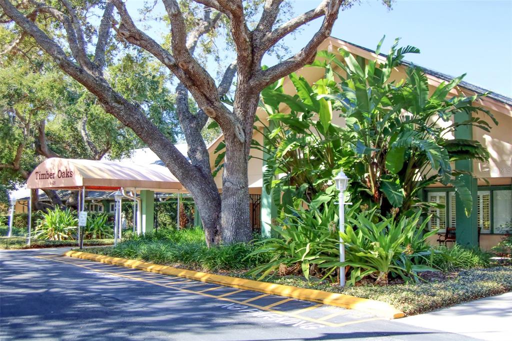 11410 Carriage Hill Drive, Unit 1 Port Richey, FL 34668 - Photo 39 of 63 a front view of a house with a yard