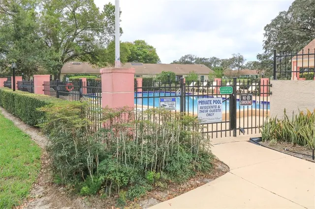a view of a room with lots of dining space and wooden floor
