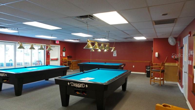 11410 Carriage Hill Drive, Unit 1 Port Richey, FL 34668 - Photo 43 of 63 a room with pool table and windows