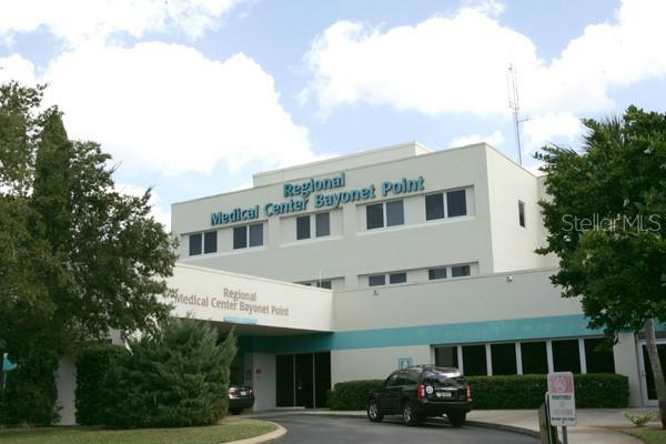 11410 Carriage Hill Drive, Unit 1 Port Richey, FL 34668 - Photo 54 of 63 a view of a building with a street view
