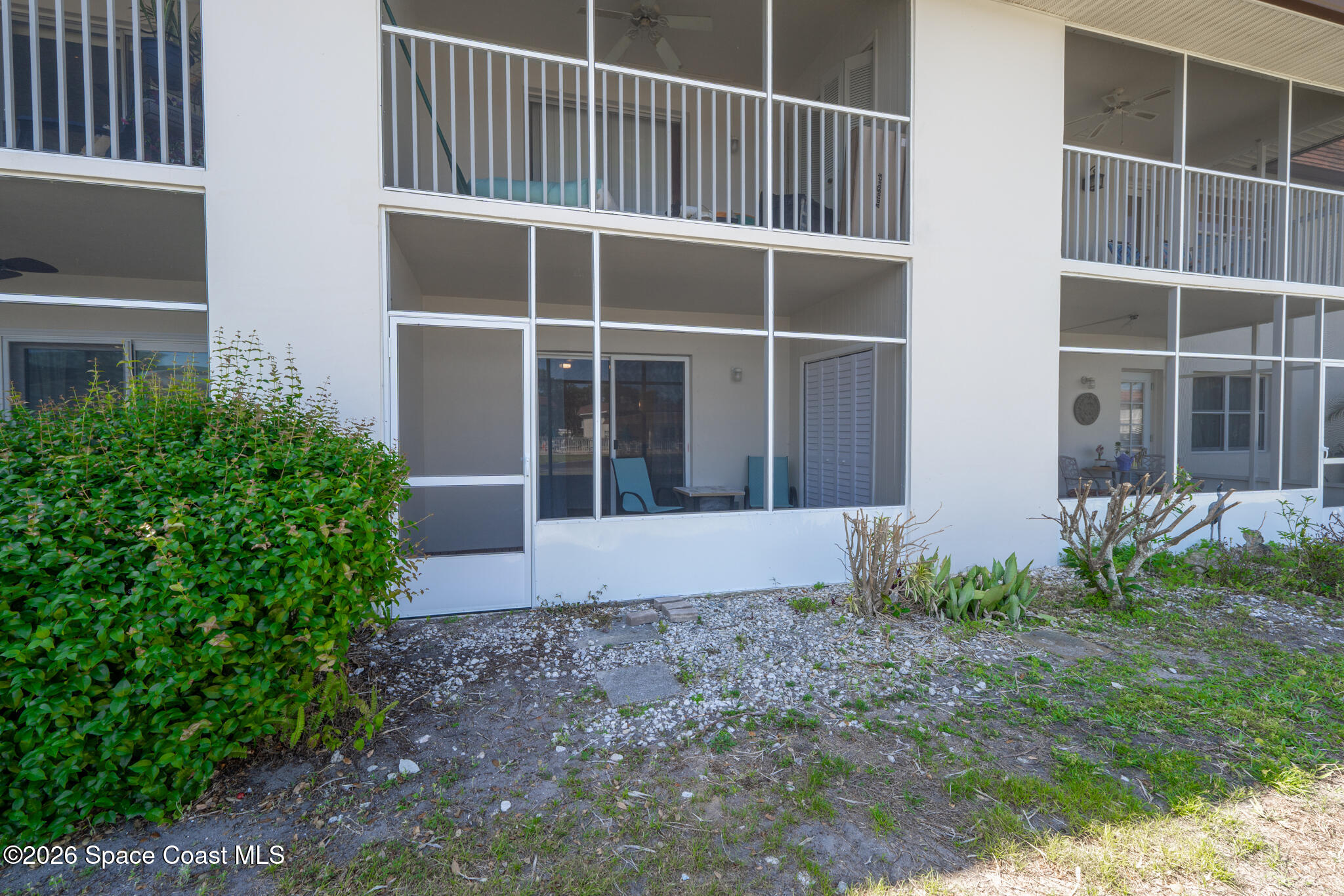 150 Intrepid Way, Unit 8D Cape Canaveral, FL 32920 - Photo 23 of 36 a view of a house with a yard