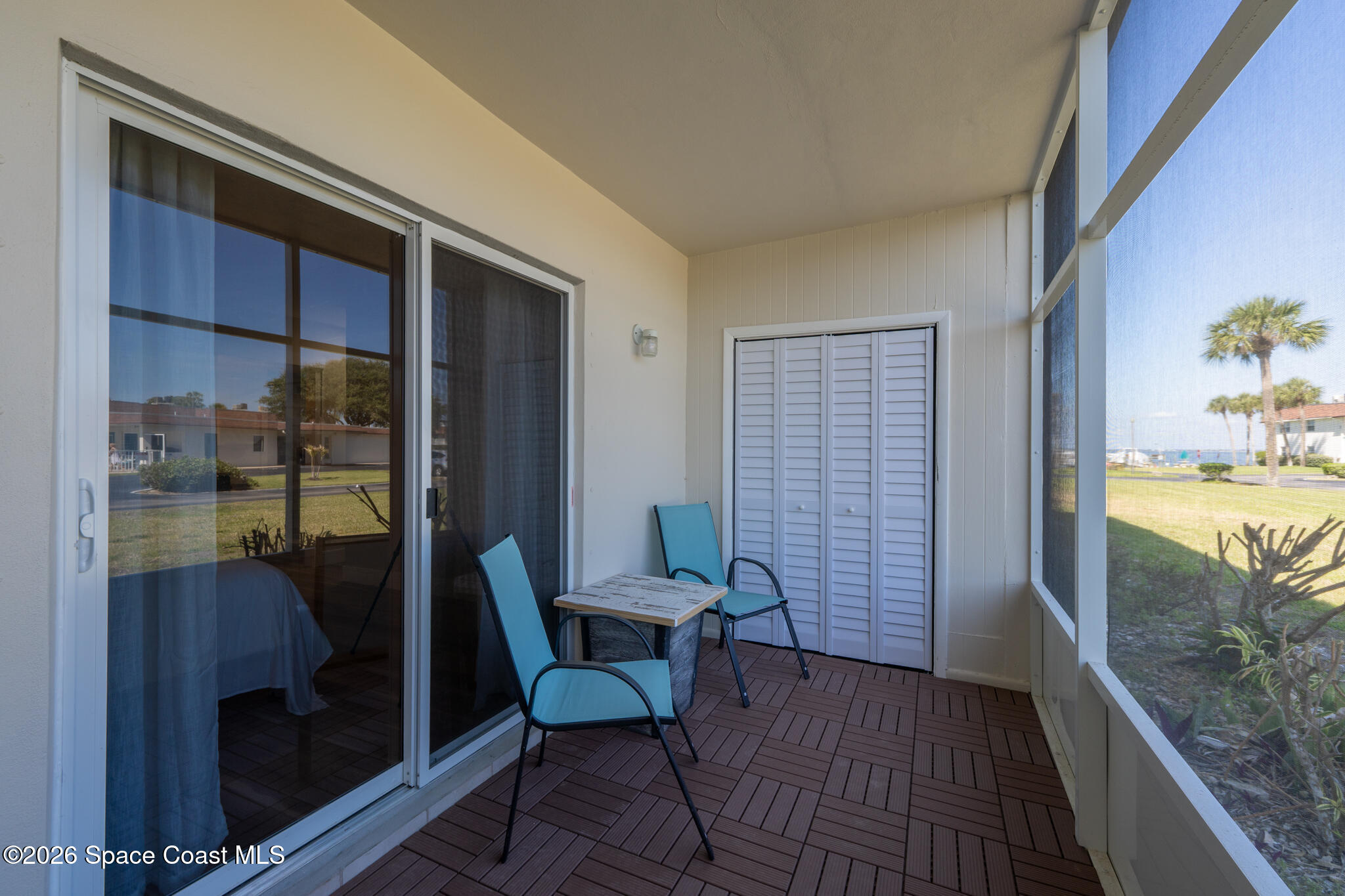 150 Intrepid Way, Unit 8D Cape Canaveral, FL 32920 - Photo 24 of 36 a view of a hallway with furniture and front door