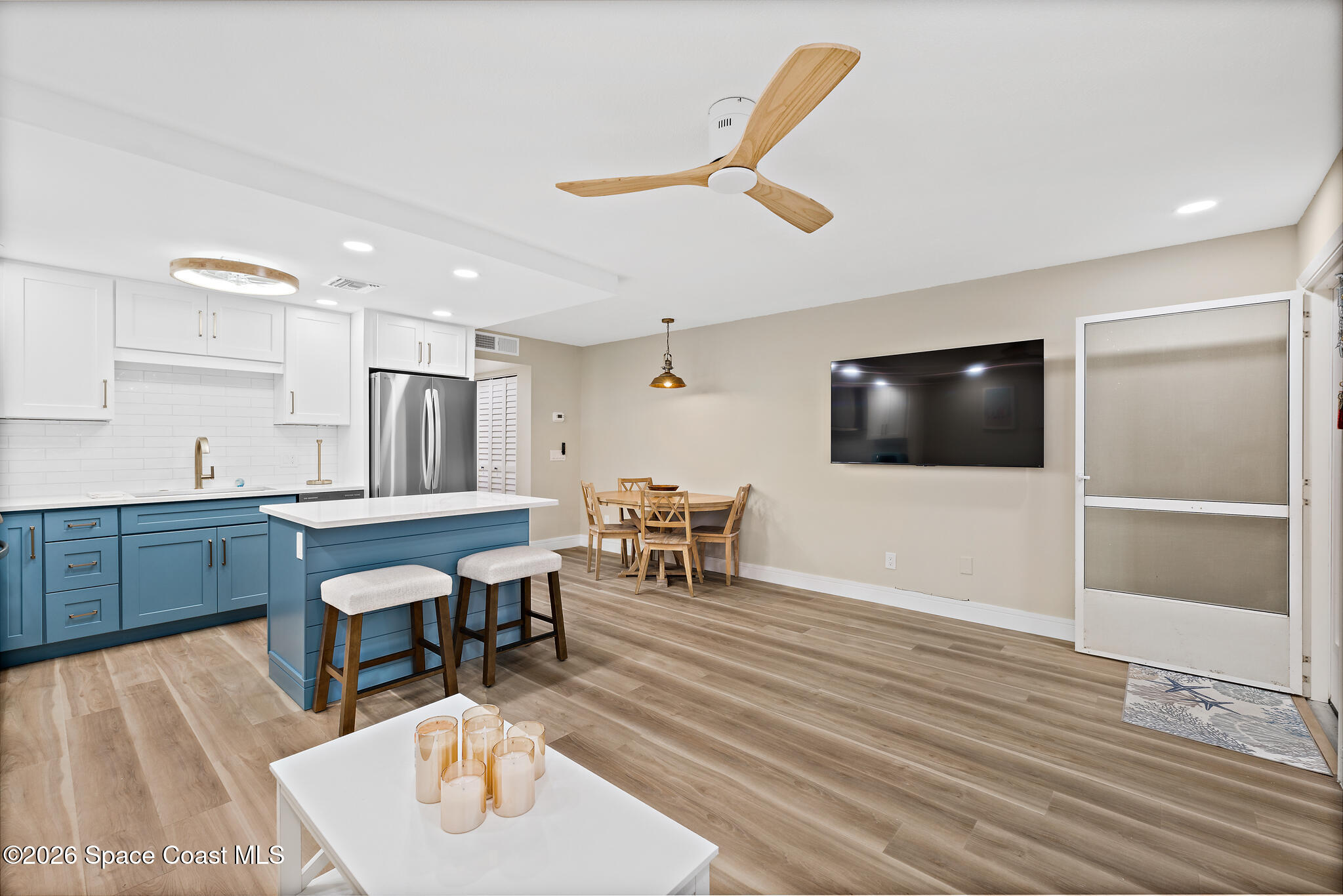 150 Intrepid Way, Unit 8D Cape Canaveral, FL 32920 - Photo 5 of 36 a living room with furniture and a flat screen tv