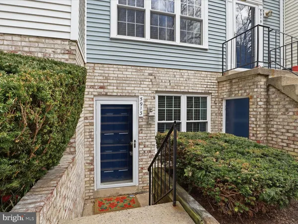 a view of front door of house and tree