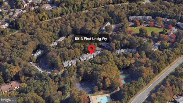 a sign that is on a brick wall